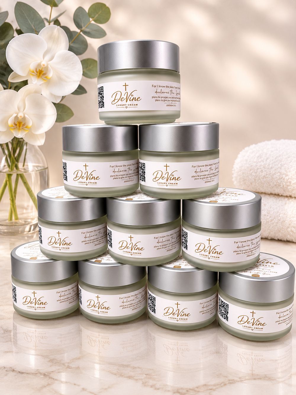 A pyramid of DeVine Luxury Cream jars